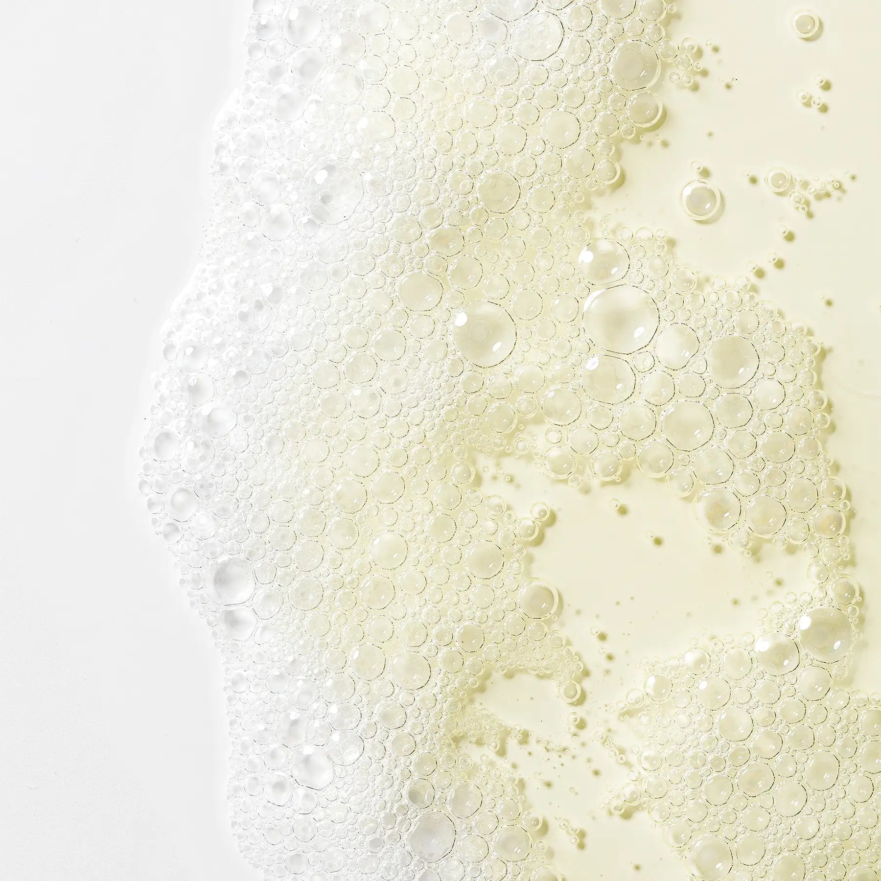 Close-up of bubbles in a liquid on a gradient background