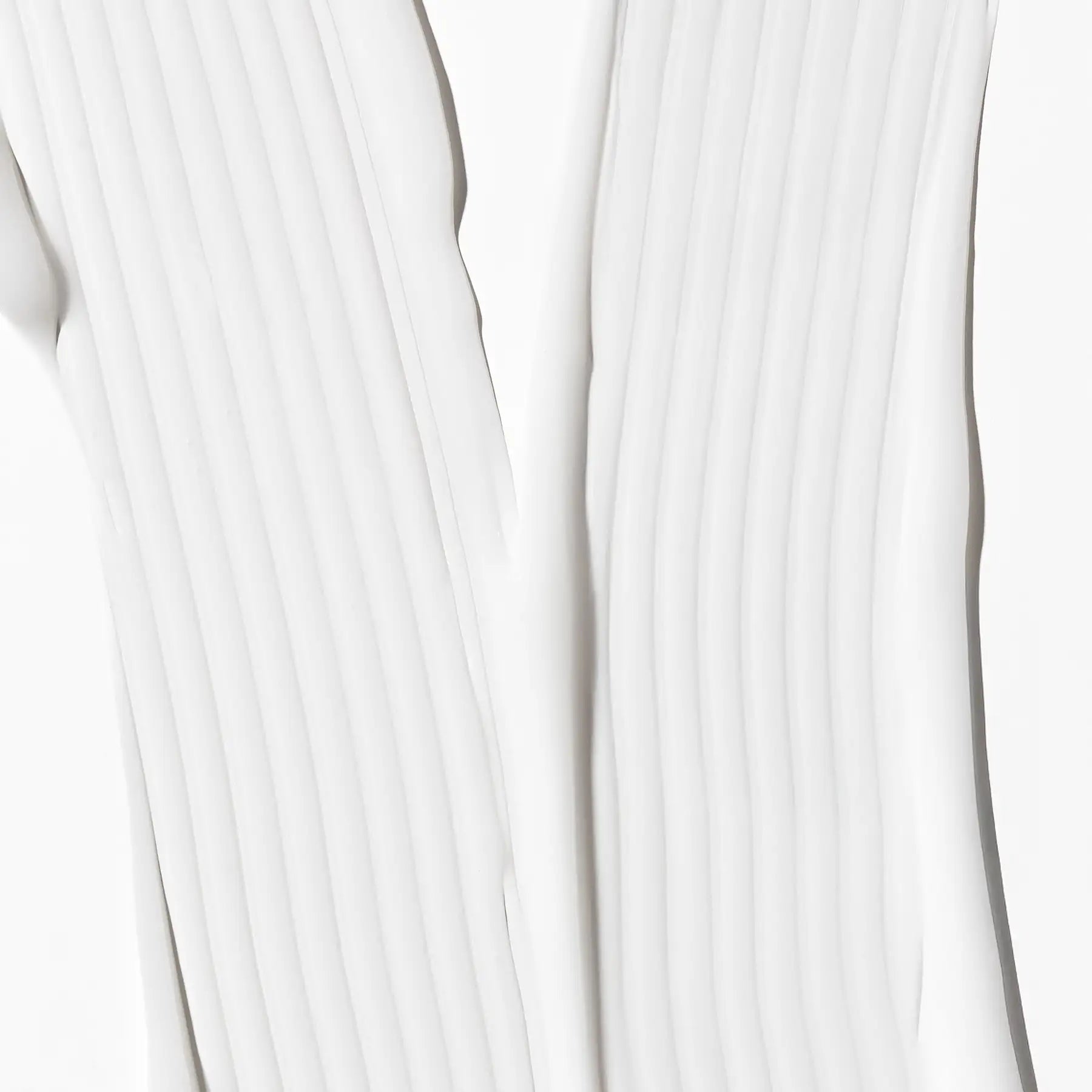 Close-up of white fabric with a subtle pattern