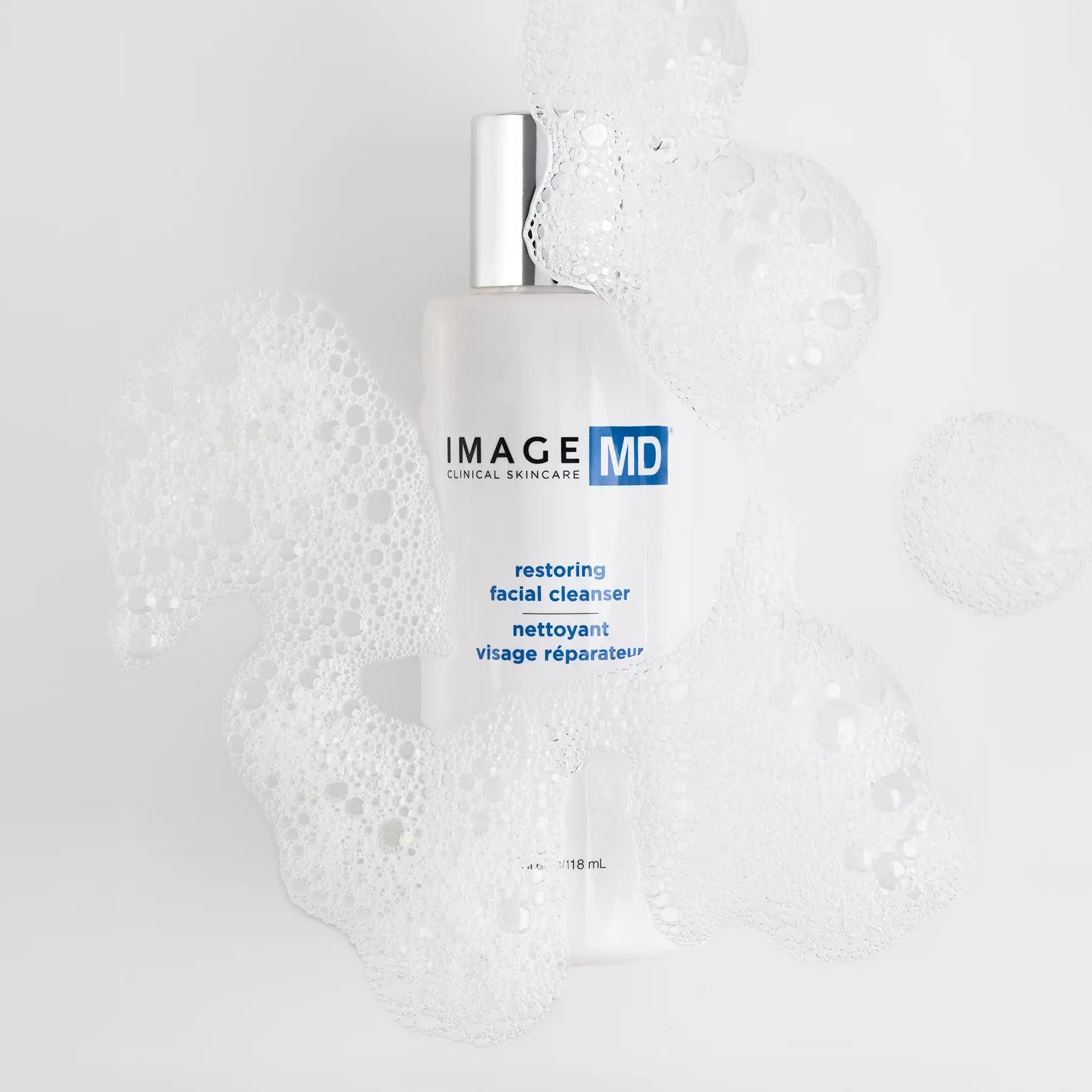 IMAGE MD restoring facial cleanser bottle on a textured white background