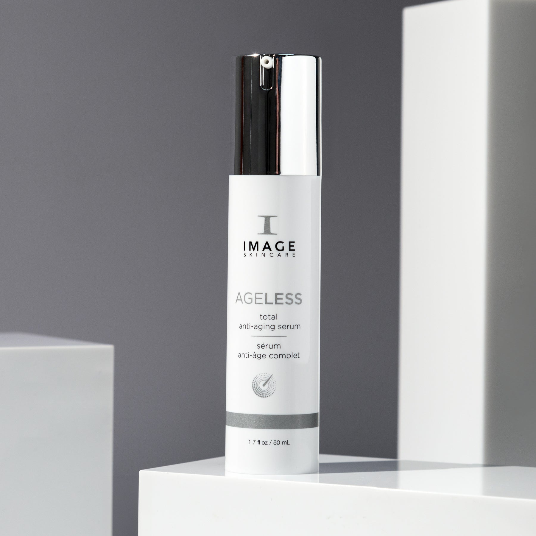 Ageless serum bottle on gray background