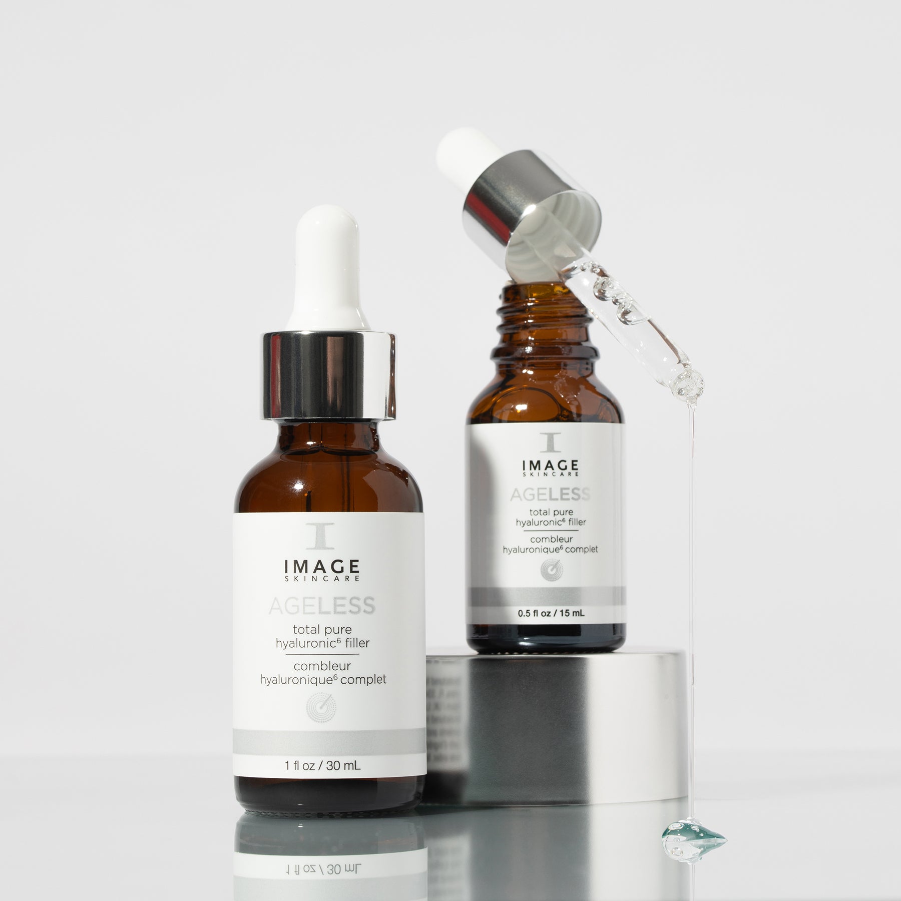 shot of hyaluronic 6 filler retail and travel size on gray background