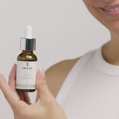 video of model applying serum to face