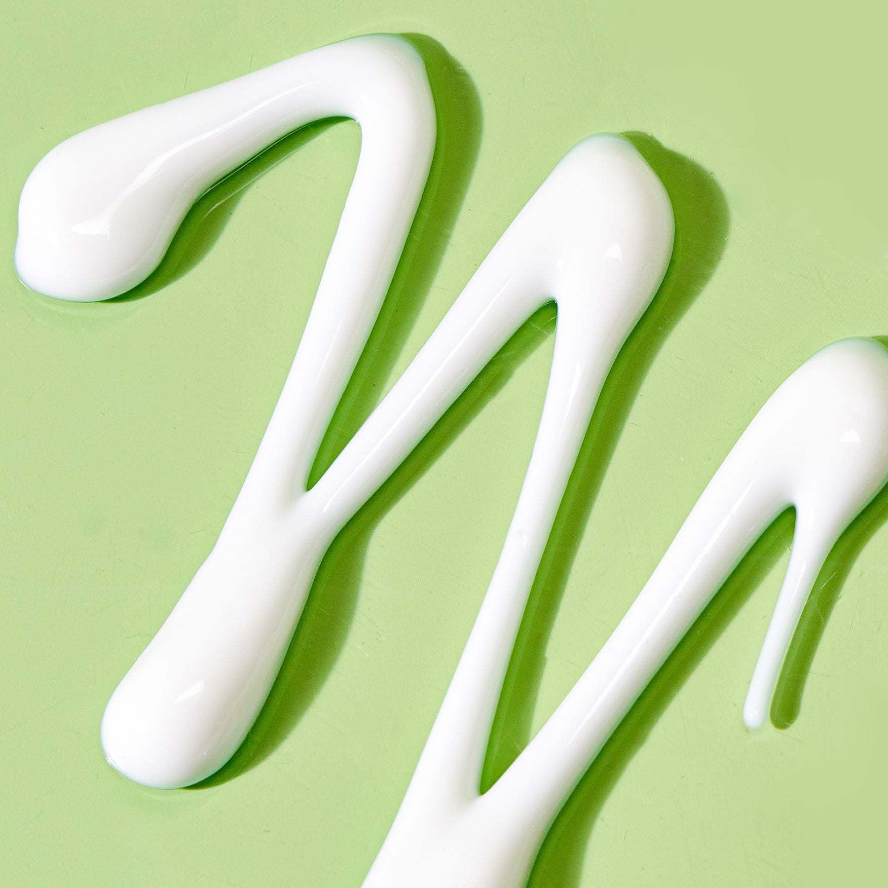 texture shot of cleansing comfort balm on green background