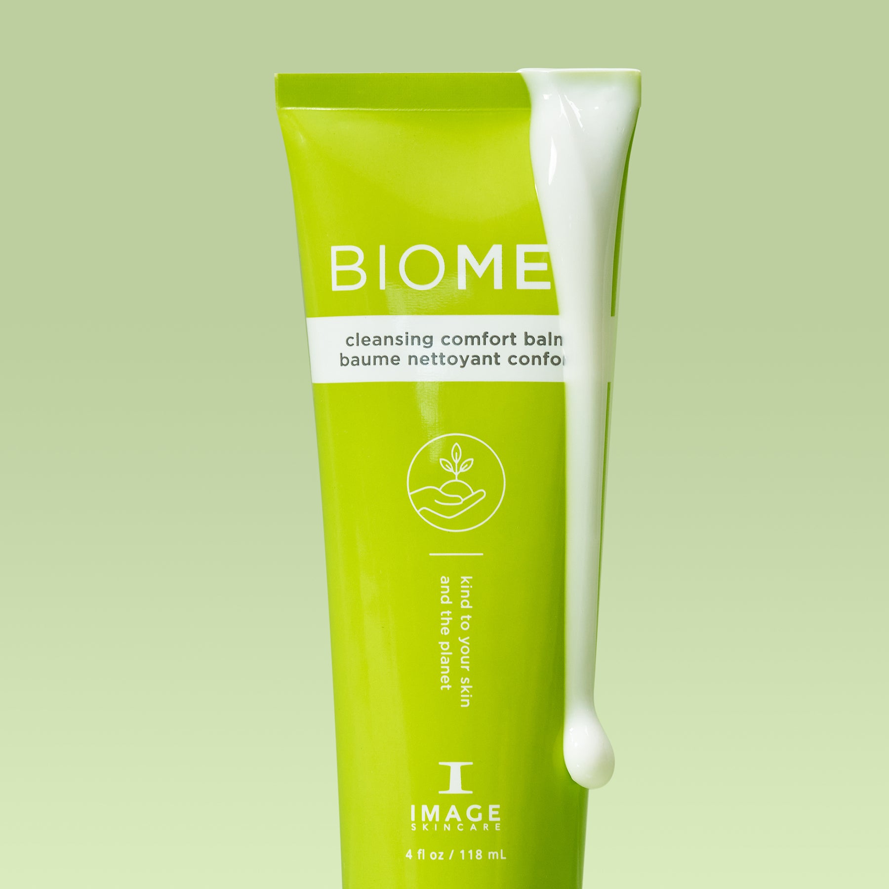 BIOME+ cleansing comfort balm tube close up with cleanser dripping from top of tube