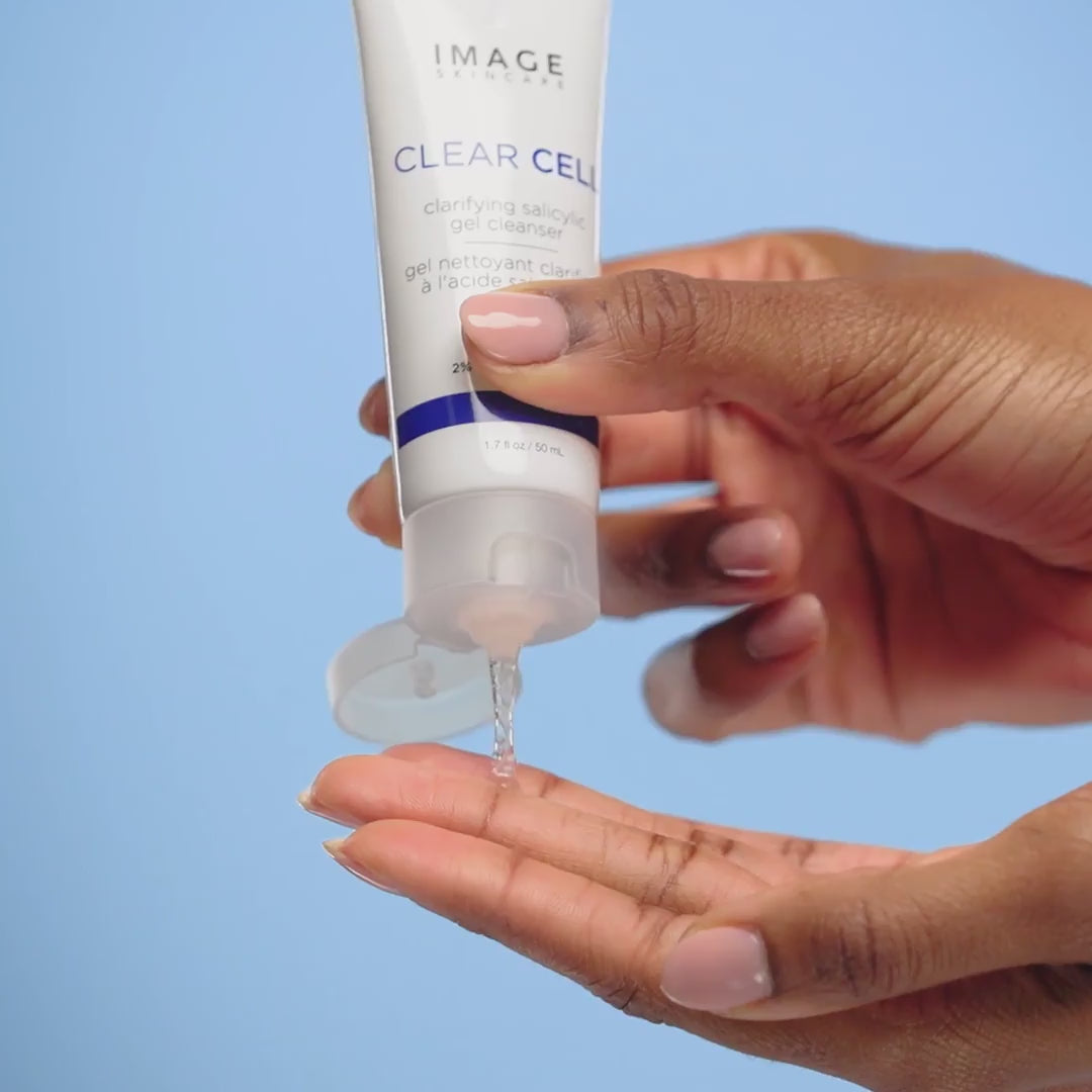 video of model applying clear cell cleanser and wiping off