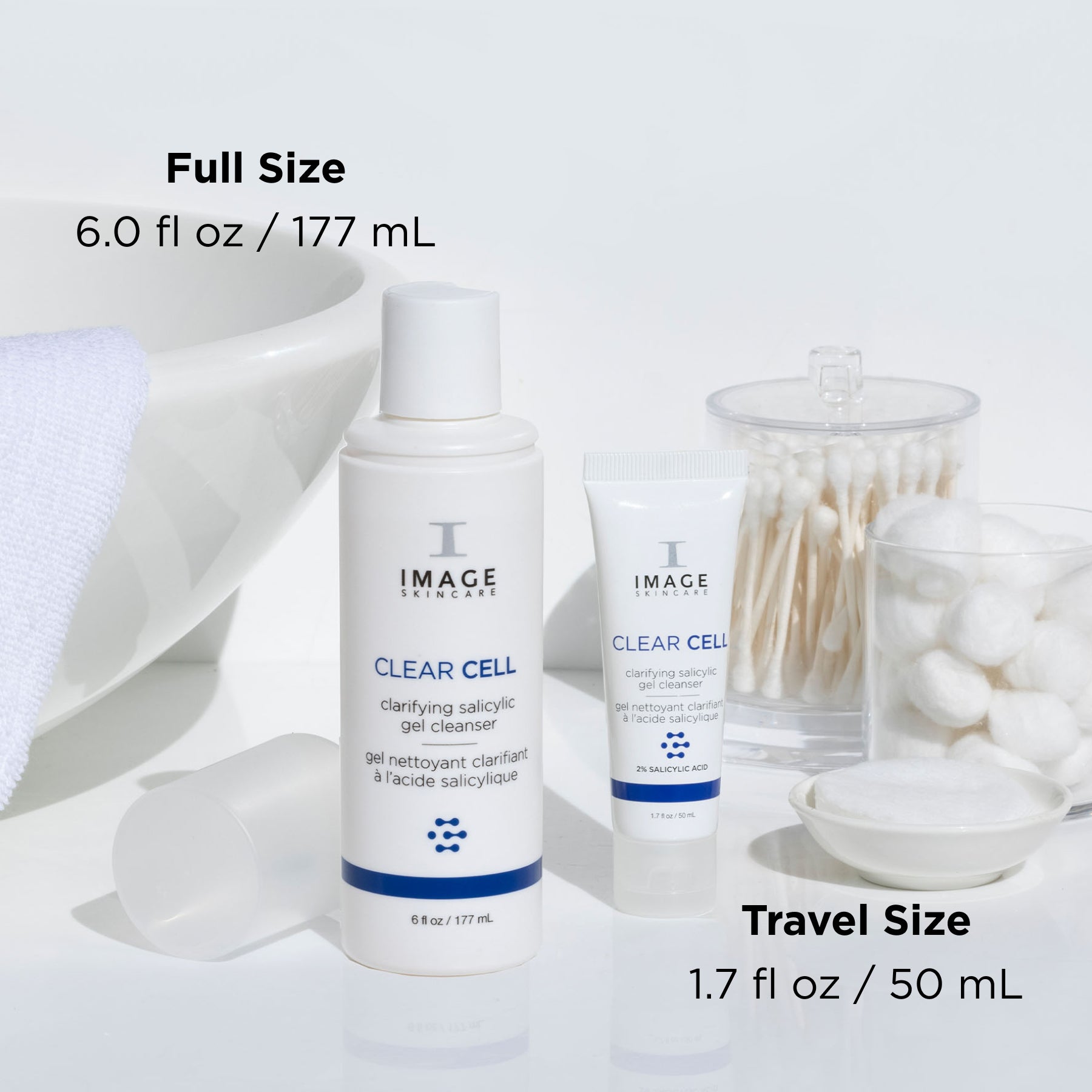 clear cell salicylic cleanser retail and travel size bottles on bathroom counter