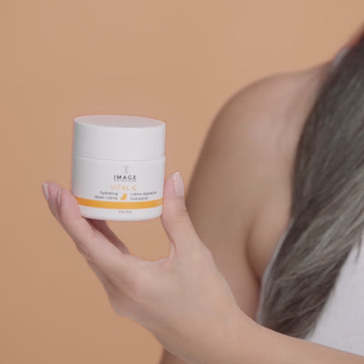 video showing model applying repair creme to face