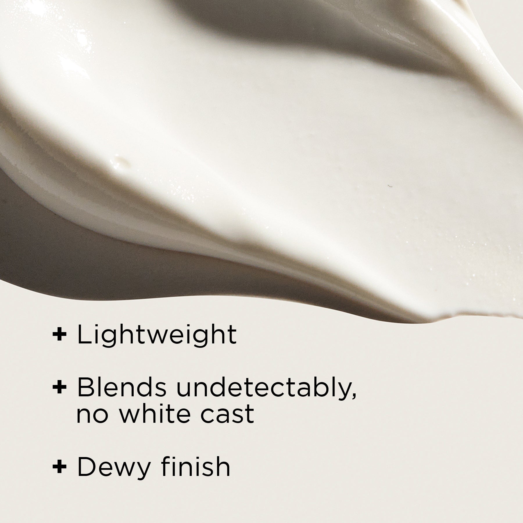 A close-up view of a smooth, creamy moisturizer texture on a neutral beige background.