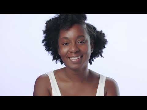 video of model applying exfoliating cleanser and wiping off