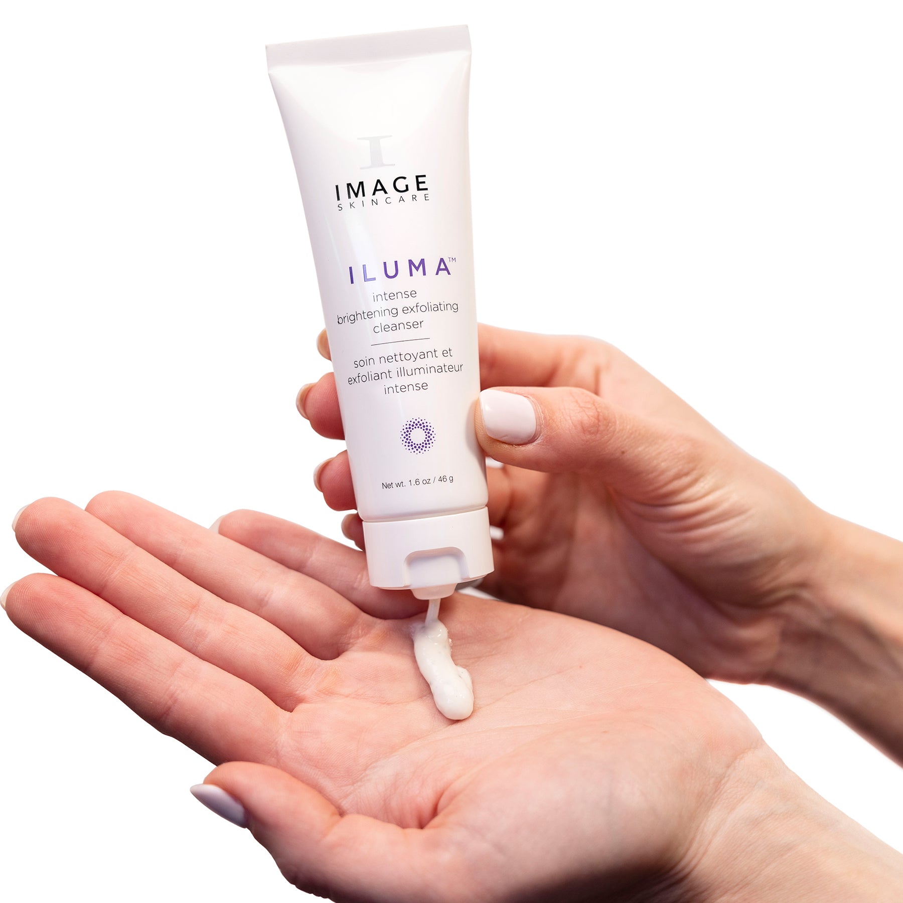 model hands holding product tube and applying cleanser to palm