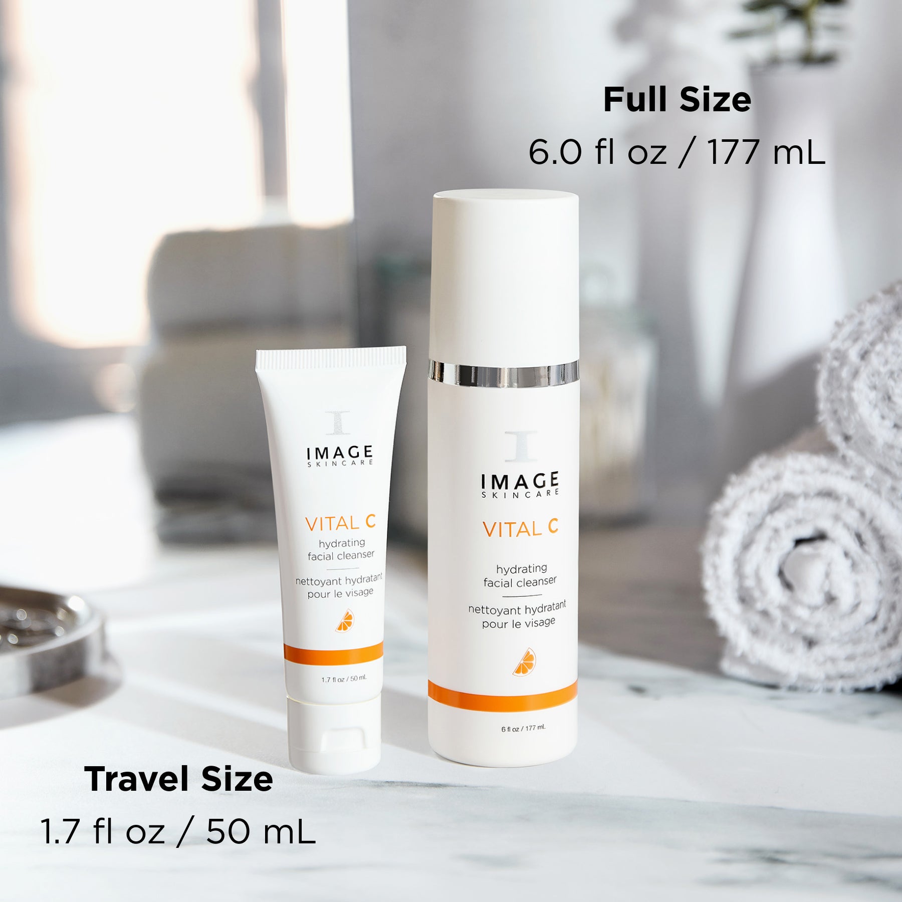 cleanser retail size next to travel size on bathroom counter