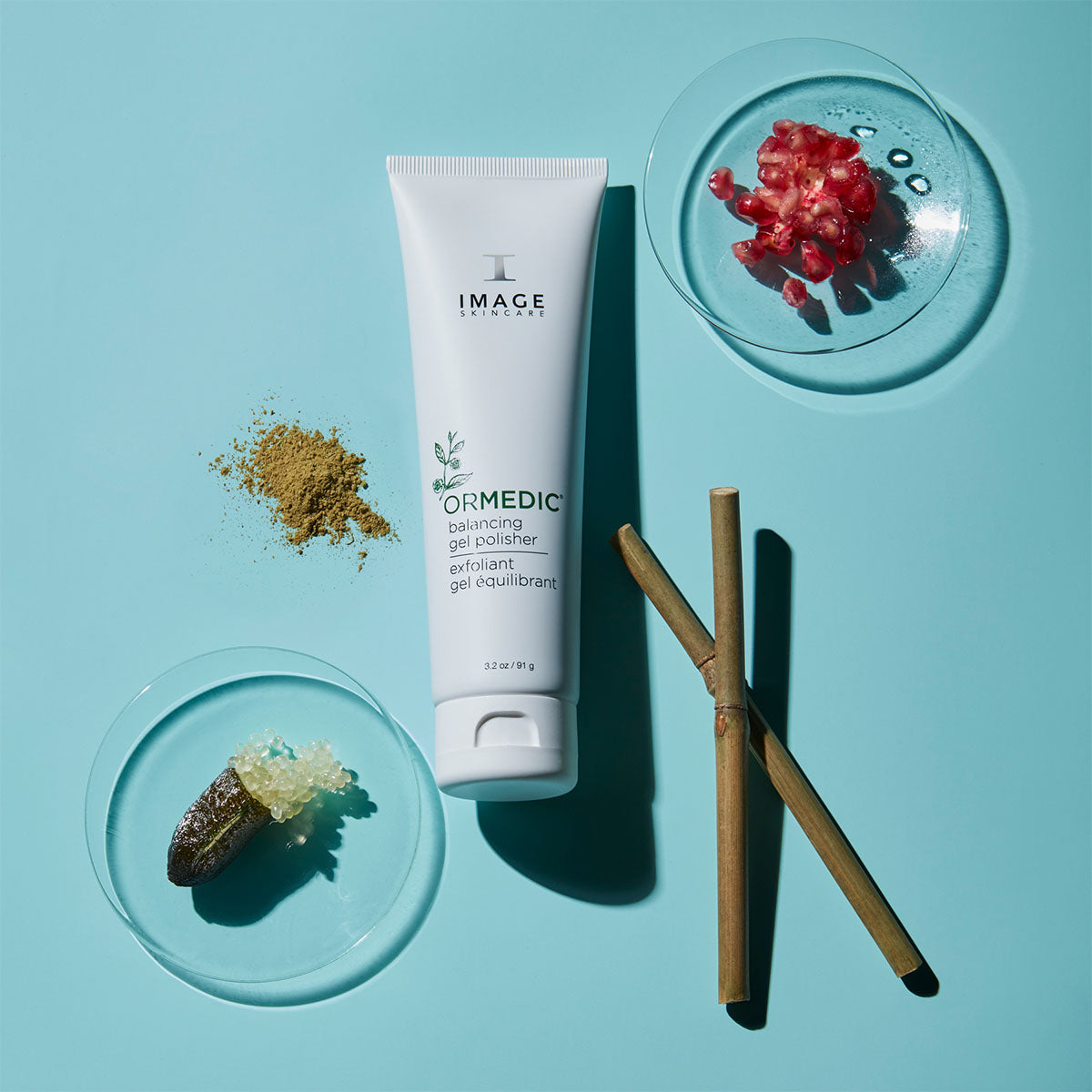 gel polisher laying on blue background surrounded by two petri dishes and product ingredients