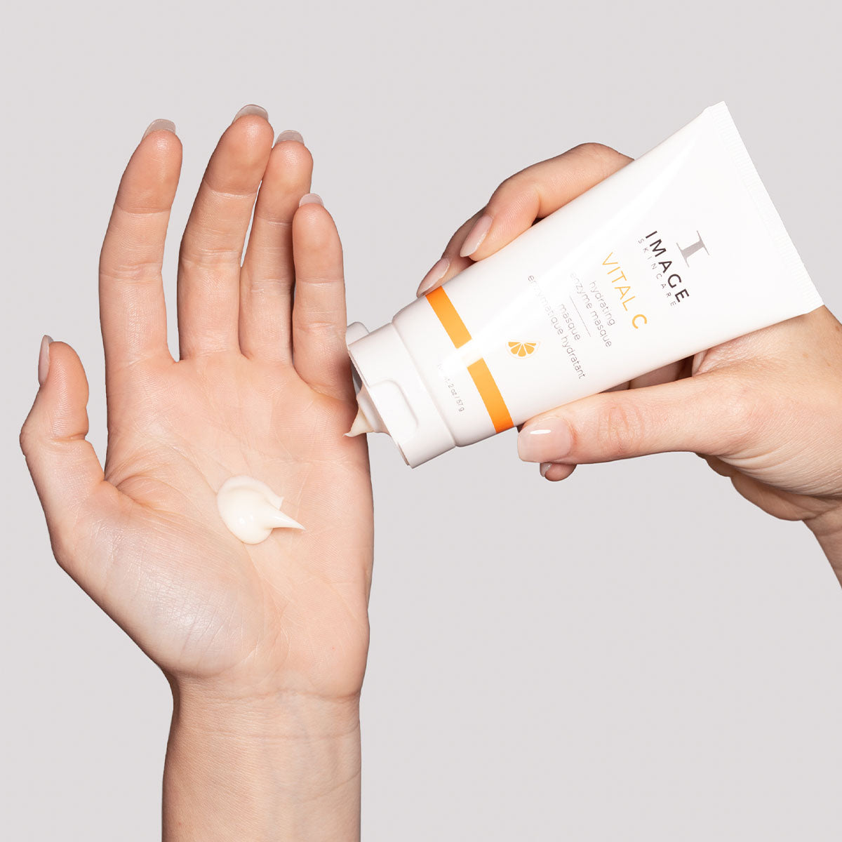 model hands applying product to palm