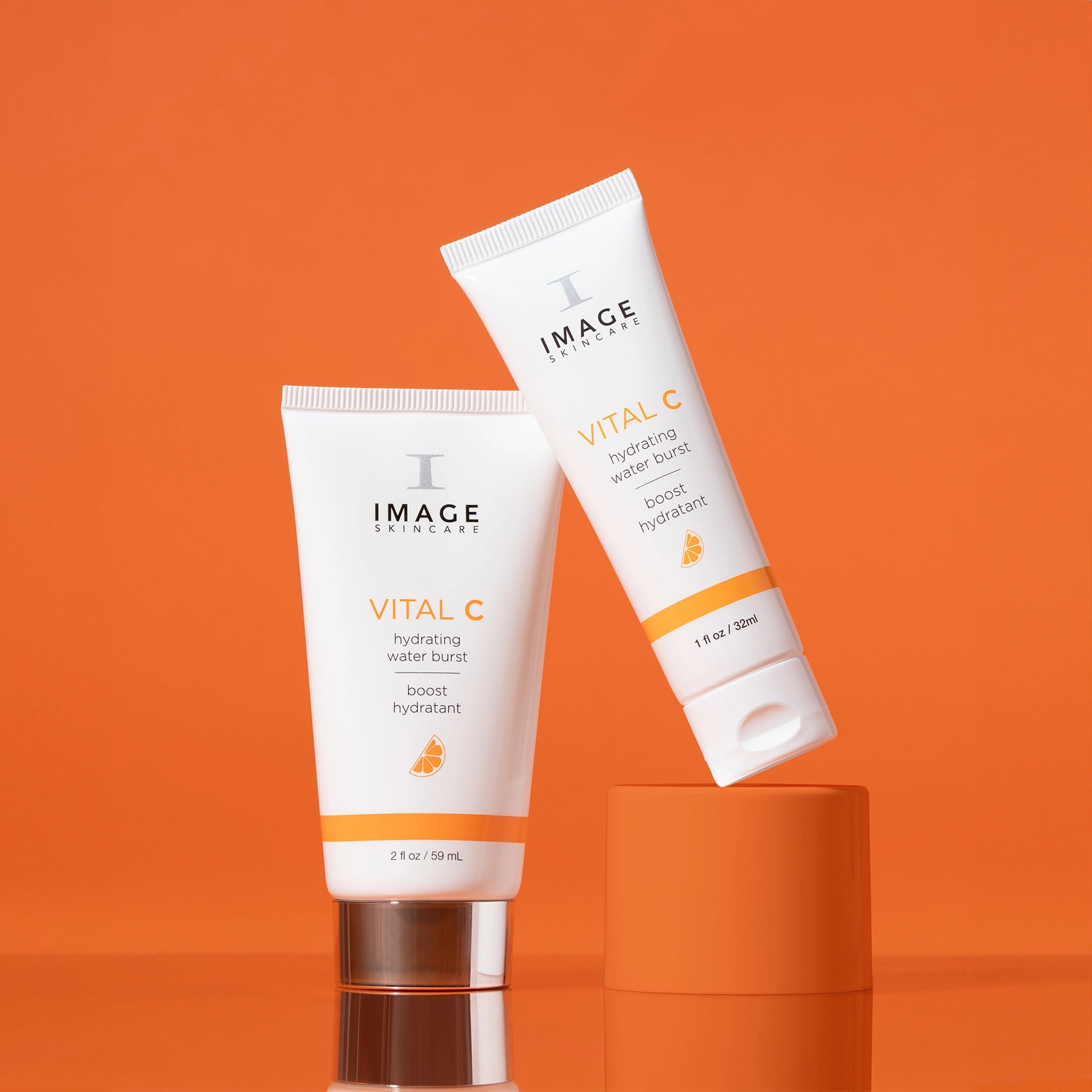 water burst retail size and travel size on an orange background