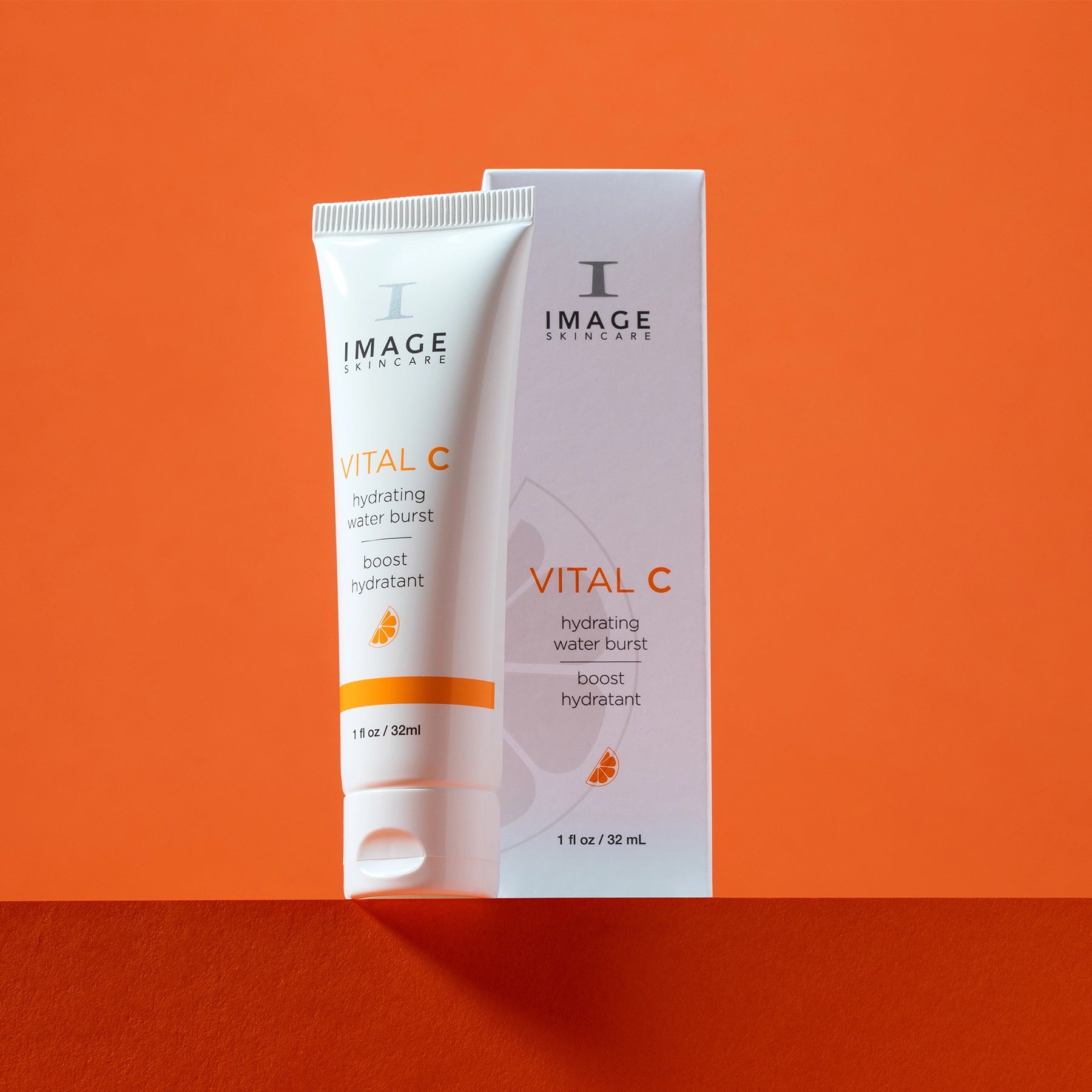 water burst next to product box on orange background