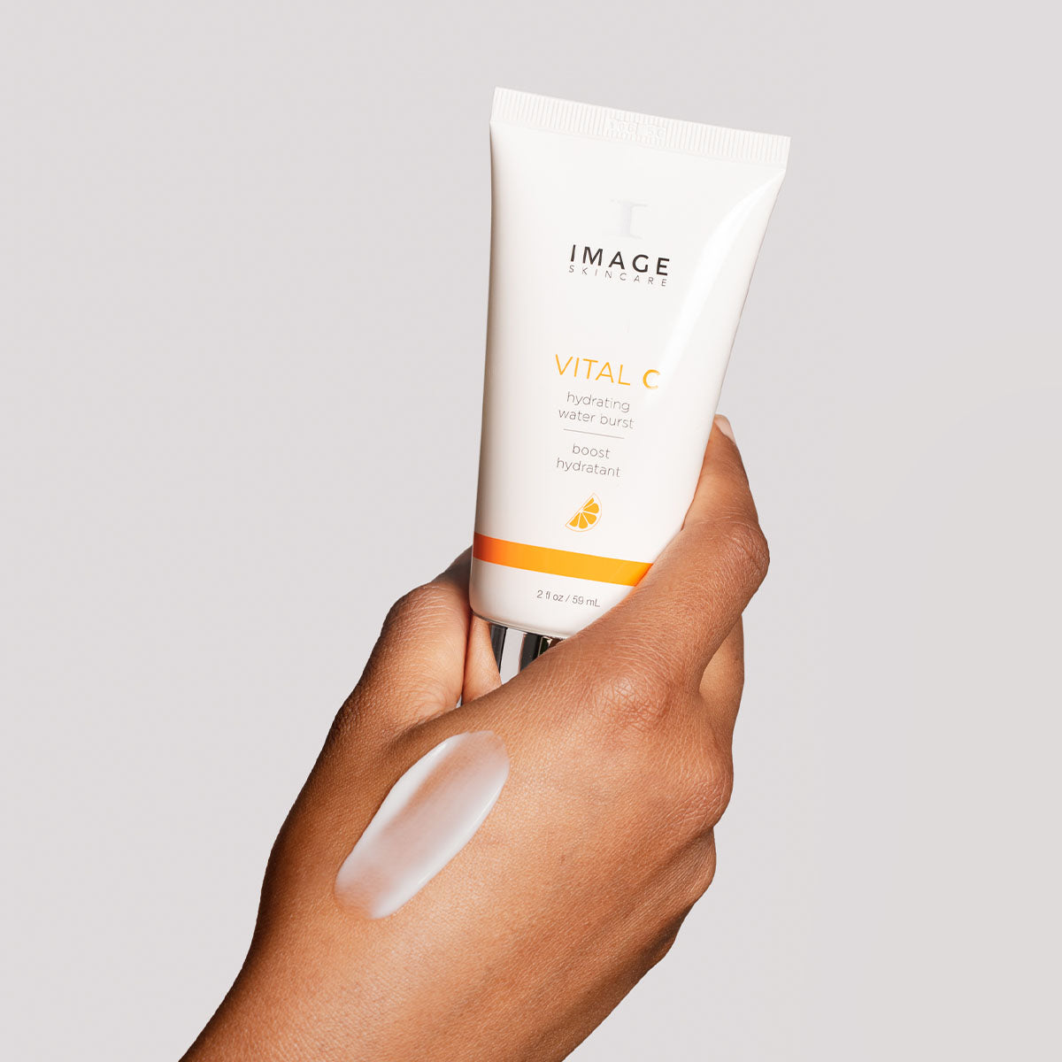 model hand holding product with texture swatch of water burst on hand