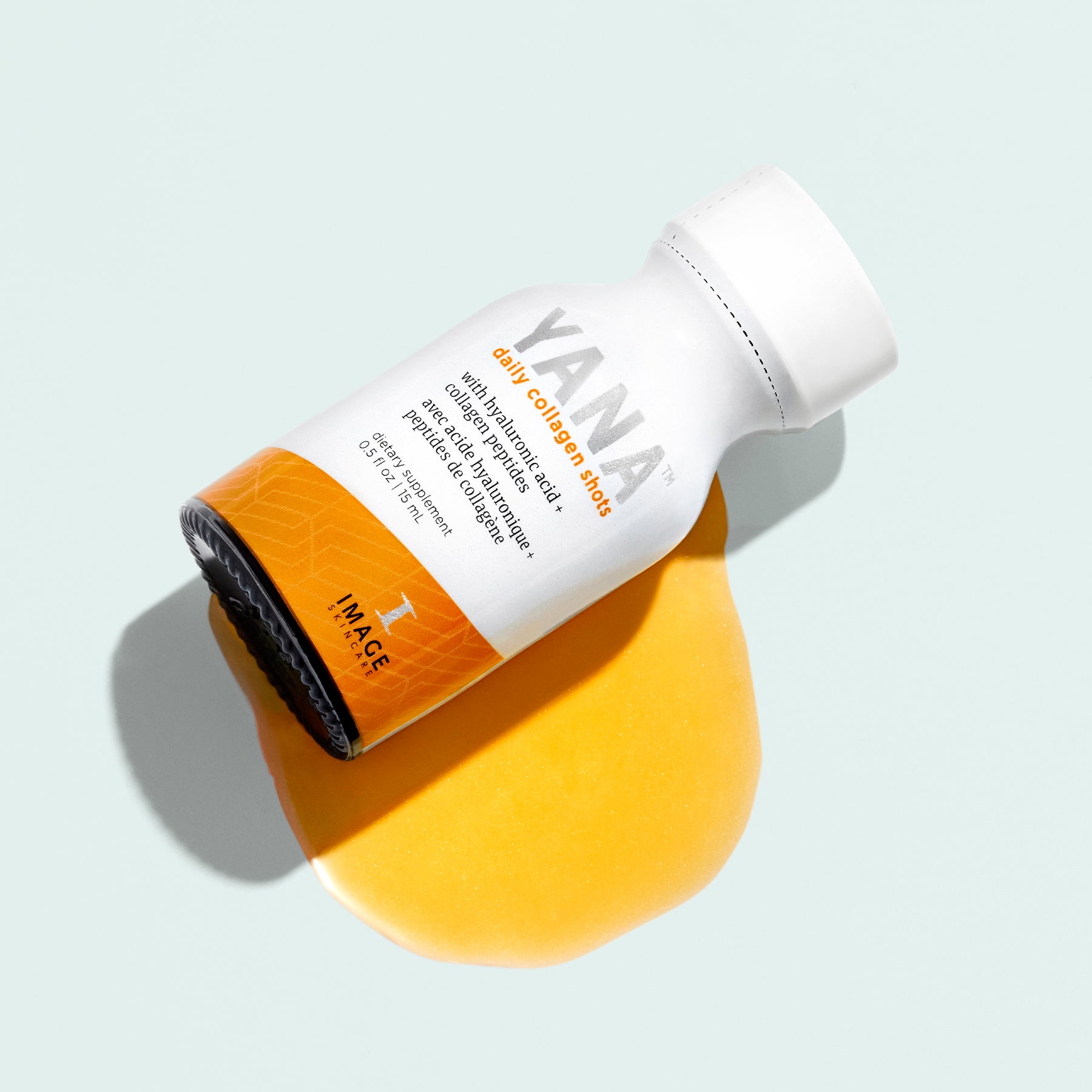 bottle of yana with liquid collagen below bottle on light background
