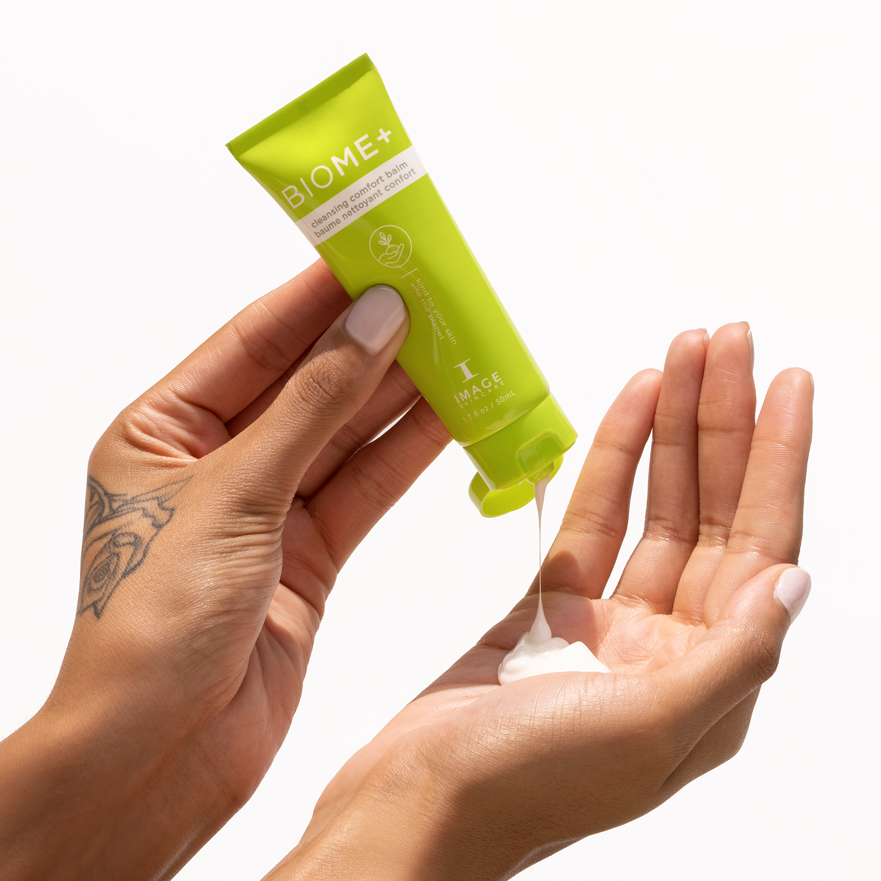 model hands dispensing comfort balm onto palm