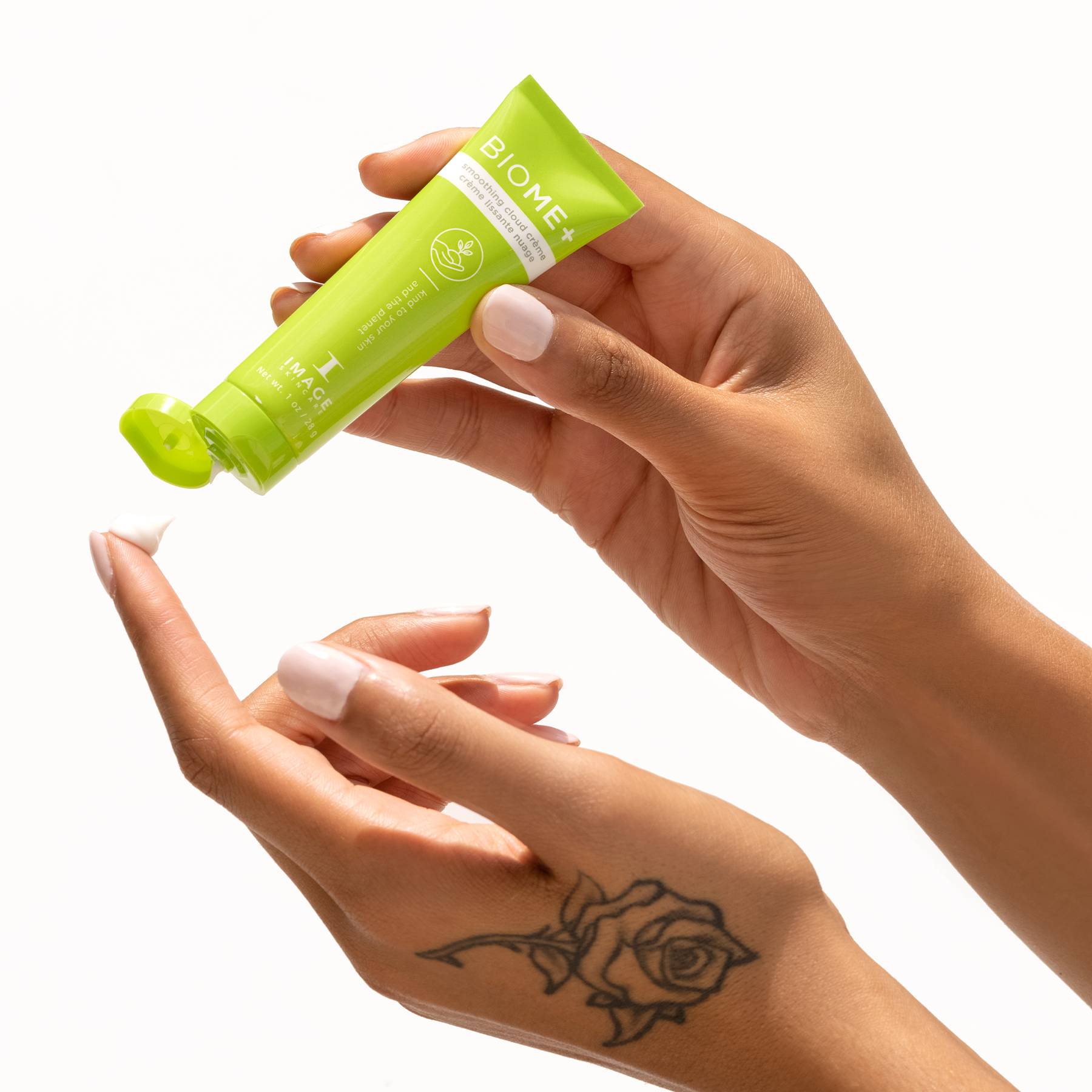 model hand applying smoothing cloud creme to finger